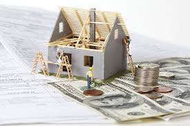 Small house under construction with money, representing real estate investment and hard money loans
